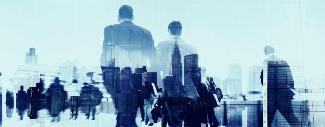 Impact of SEC’s New Cybersecurity Policies Business people walking through a city