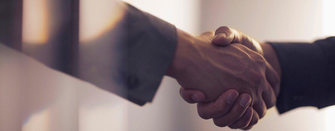 How to Enforce Least-Privileged Cloud Permissions and Stay Friends with Your DevOps Team A business handshake