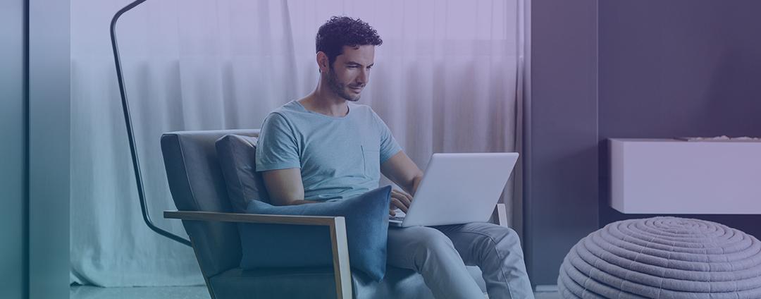 Prevent Cloud Security Breaches Attributable to Cloud Misconfigurations with CSPM guy with laptop