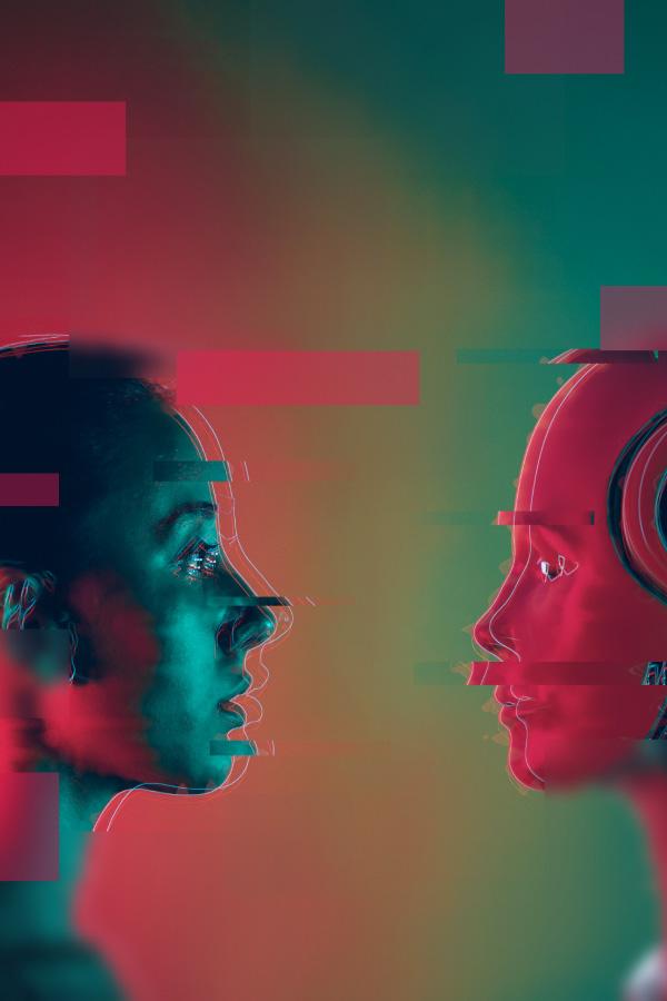 woman face-to-face with AI humanoid