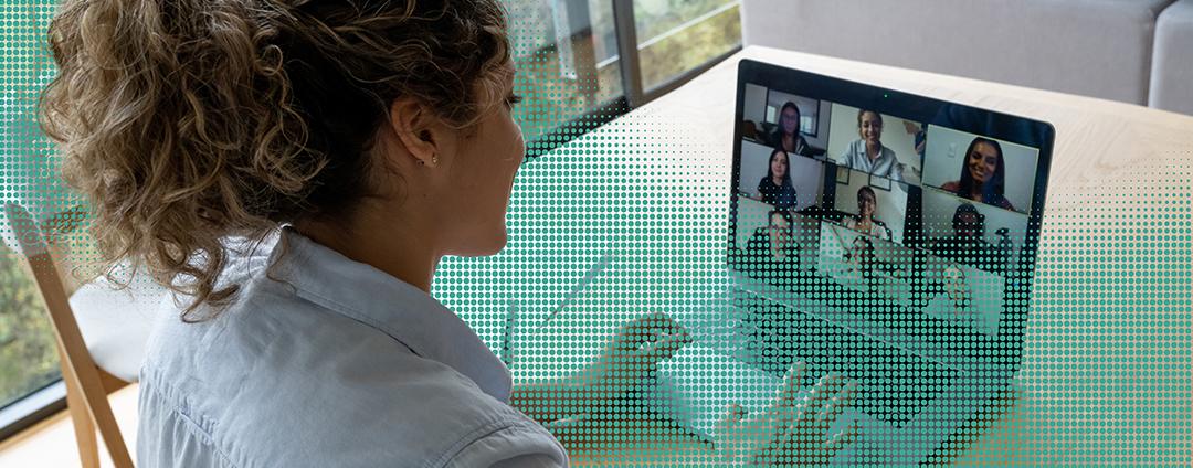 Here Comes the Hybrid Office—and It’s Going to Be a Nightmare for IT Leaders Over the shoulder shot of woman in a virtual meeting