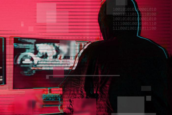 Ransomware Surges, Extortion Escalates: ThreatLabz 2025 Ransomware Report Ransomware threat actor in front of monitor