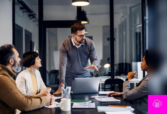 A speaker discusses malware types and their effects on data security to an engaged audience during a presentation.