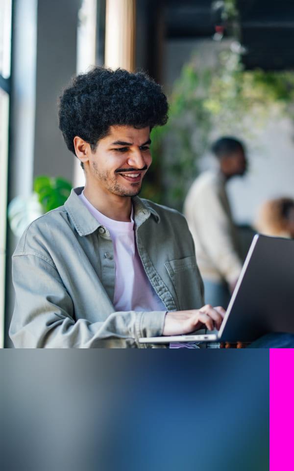 A man seated before a laptop displaying "the future of work," symbolizing secure remote access solutions.